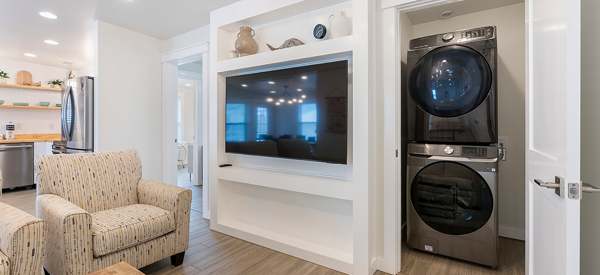 Full-size washer and dryer inside The Beach Break