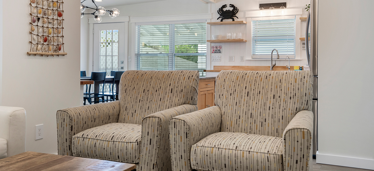 Comfortable chairs in the living room at The Beach Break